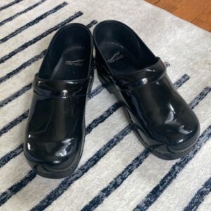 Dansko black patent clogs